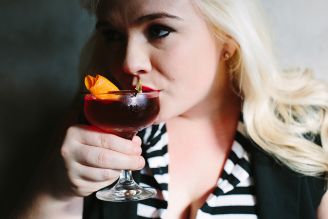 Brynn Smith sips her That's Amore cocktail at Sotto